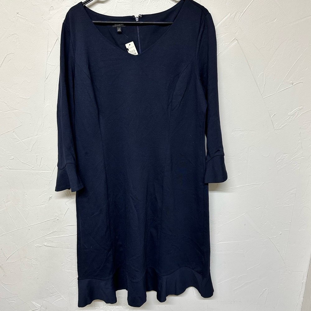 NWT. Navy Shift Ponte 3/4 sleeve dress with ruffle detail at hem and sleeve.